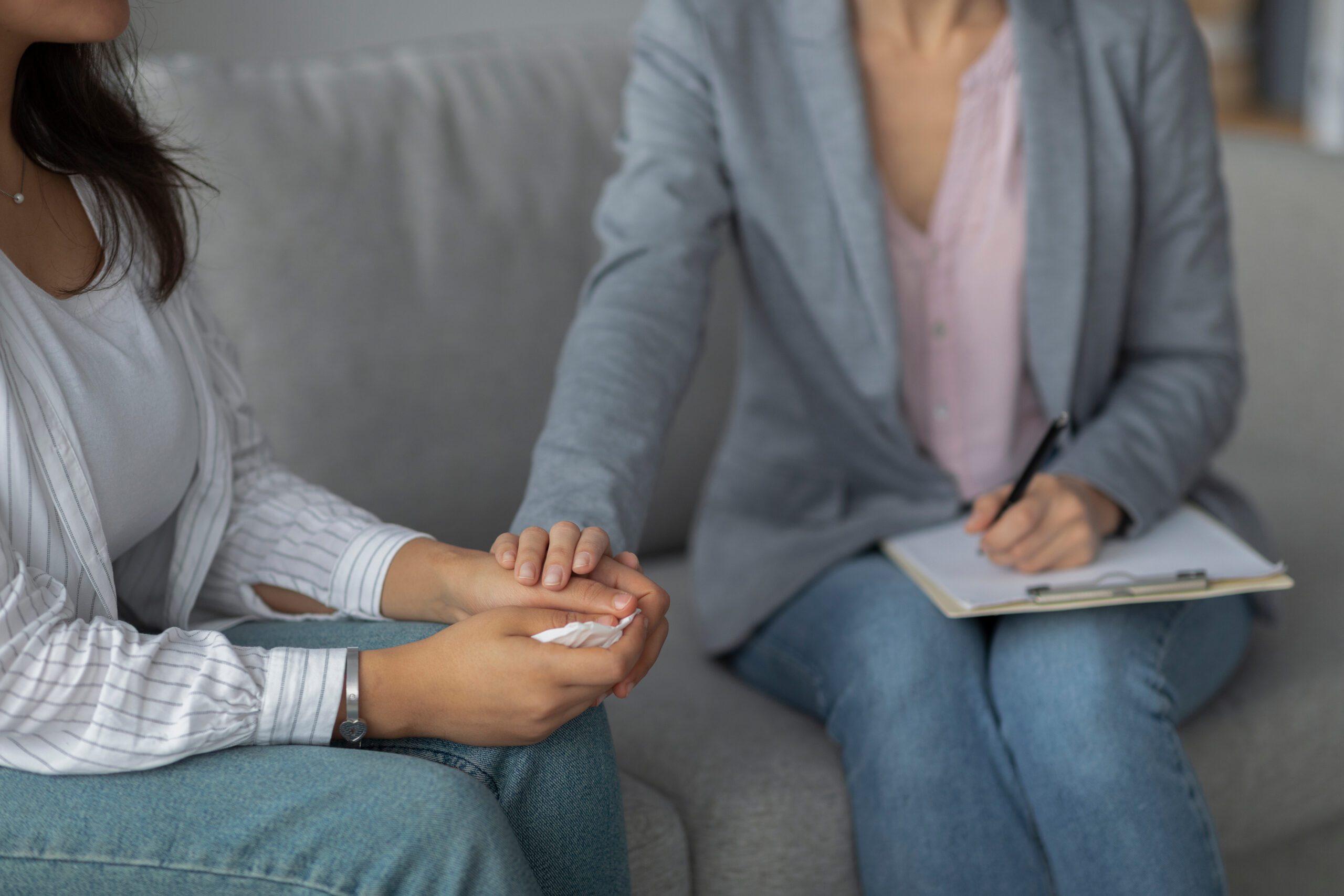 A supportive interaction between a professional and a resident in a calm setting.