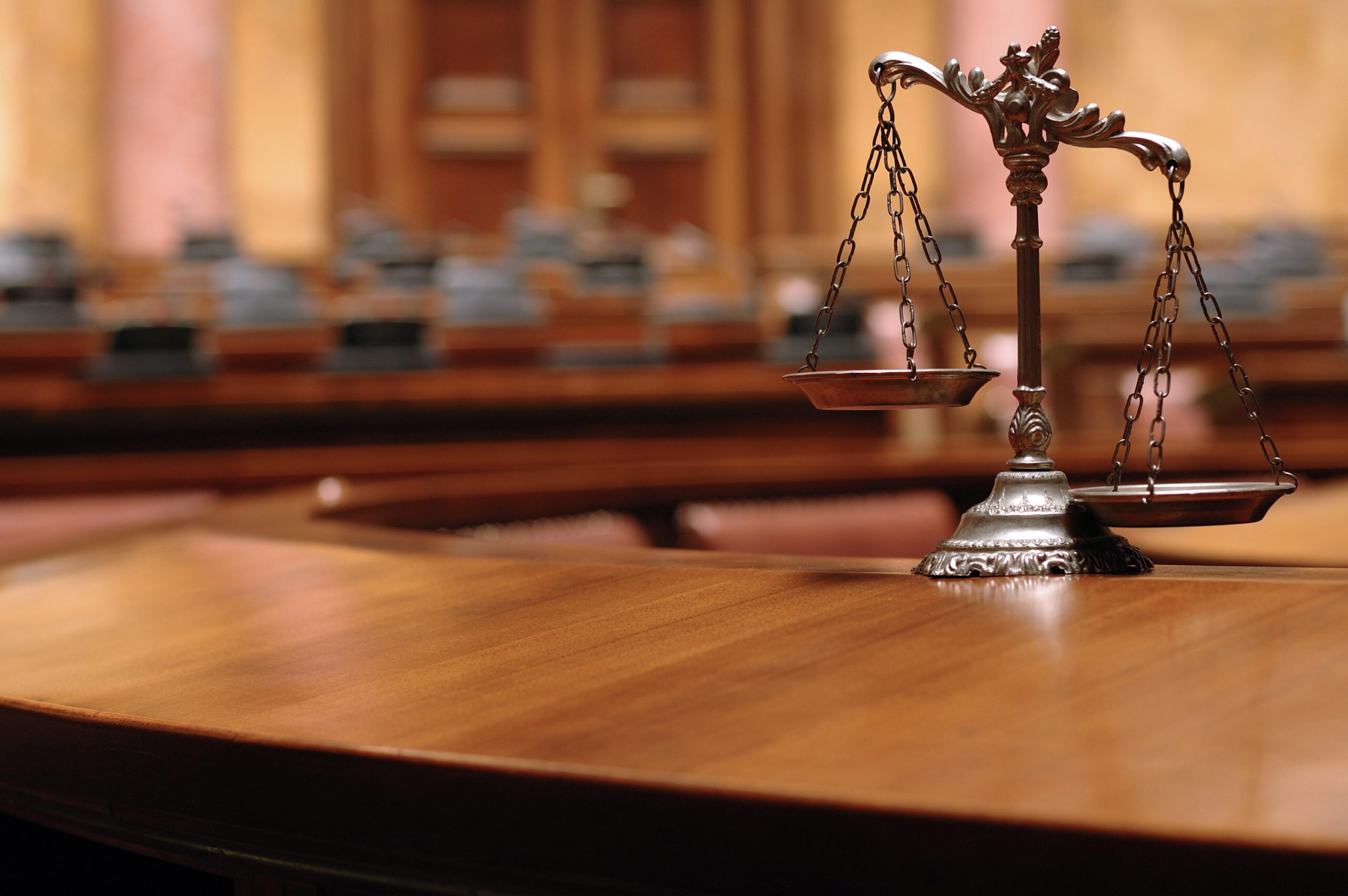 Decorative Scales of Justice in a courtroom.
